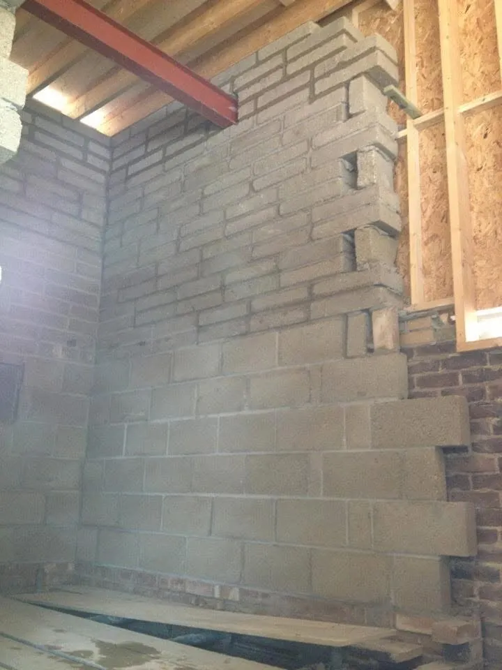 Yellow stock brick elevation over a carport opening, matched to the house, by Cambourne Brickwork & Building