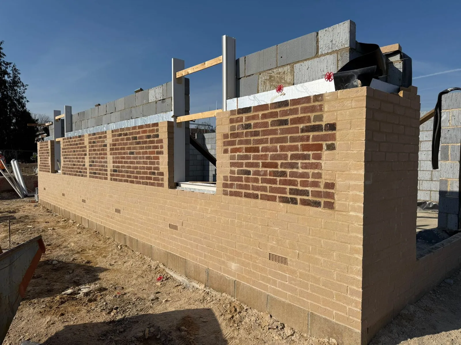 New-build brick and block cavity wall with cast-stone cills, by Cambourne Brickwork & Building