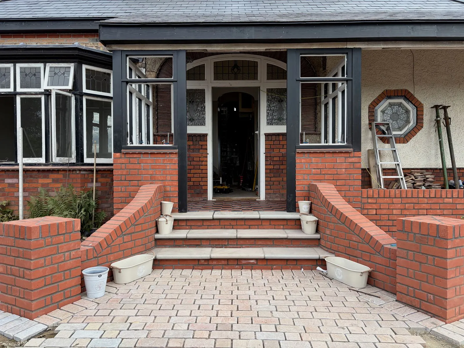 Restored period entrance with brick balustrades, curved ramps and stone steps, by Cambourne Brickwork & Building